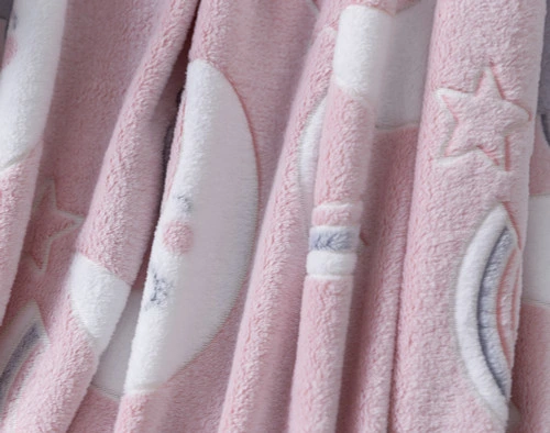 Close-up of some ruffled fabric on our ______ Glow in the Dark Fleece Throw to show its soft fleece surface.