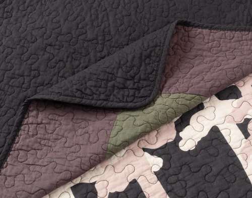 Folded corner on our Rock River Cotton Quilt Set to show its face and reverse patterns together.