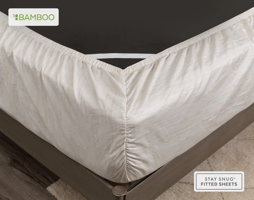 Flipped mattress corner wrapped with our Crosshatch Bamboo Cotton Sheet Set's fitted sheet to show its snug fit.