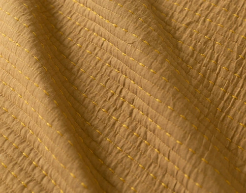 Close-up view of the smooth cotton reverse on our Casimir Quilt Set.