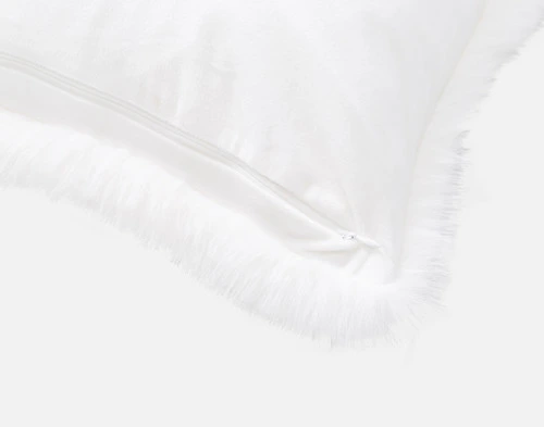 Close-up on the velvety smooth reverse and zipper enclosure on the corner of our Polar Fur Euro Sham in White.