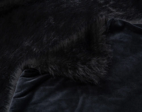 Folded faux fur corner on our Polar Fur Throw in Onyx.