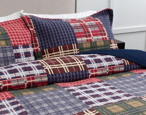 Angled view of our Harrison Cotton Quilt Set to show its full gingham patchwork pattern.