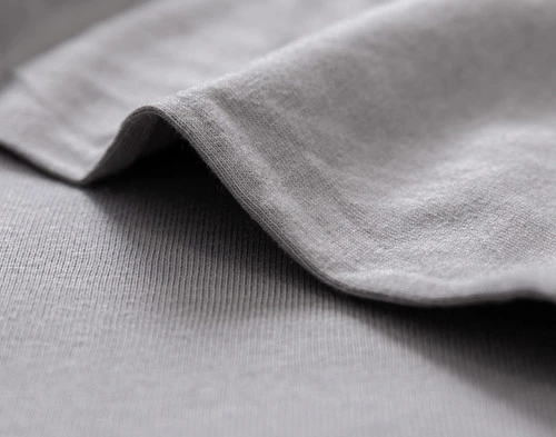 Close-up on the clean edge on our Bamboo Cotton Jersey Sheet Set in Grey.