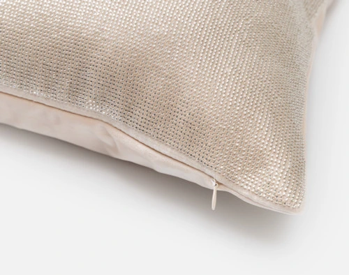 Close-up on the corner and zipper enclosure on our Beaded Square Cushion Cover in Champagne.