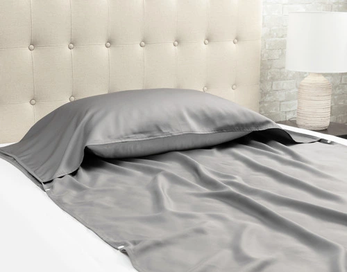 Angled view of our TENCEL™ Modal Sleep Sack with a pillow resting inside its top fold.