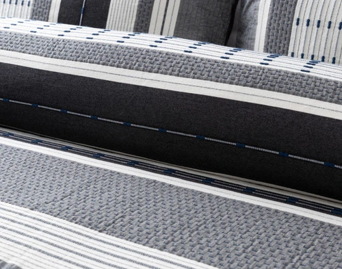 Close-up on the alternating grey and white lines on our Dash Duvet Cover.