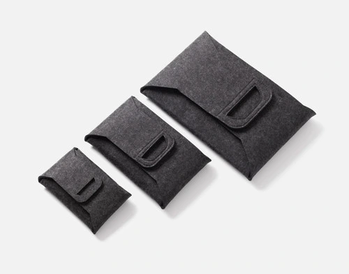 Our three Collapsible Felt Baskets folded into tidy flat squares.