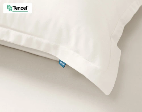 Close-up on the flanged edge border on the corner of our BeechBliss TENCEL™ Modal Pillow Sham in Cloud.