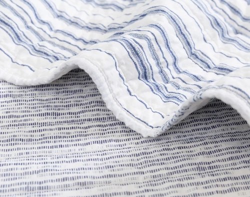 Folded edge on our Frankie Cotton Quilt Set to show two of its alternating striped patches.