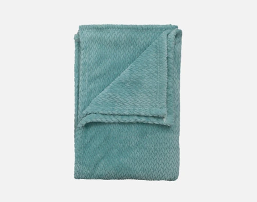 Our Chevron Plush Throw in Aqua folded into a tidy square.