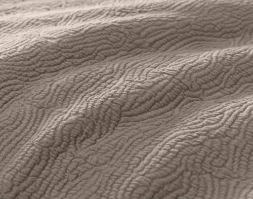 Close-up view of the textural rippled surface of our Brava Duvet Cover.