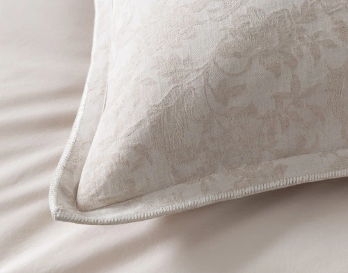 Close-up on the flanged edge border and white embroidered stitching on the corner of our Prescott Euro Sham.