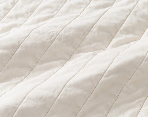 Close-up on the striped stitch backing on our Golden Hills Cotton Quilt Set.