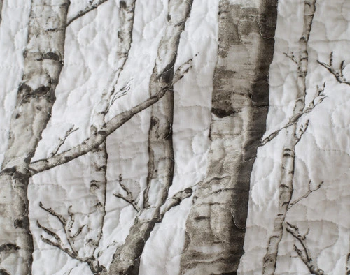 Close-up on the scenic birch trees and winding top-stitching on our White Birch Cotton Quilt Set.