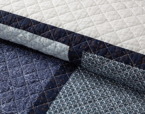 Close-up on the soft cotton surface of our folded Abilene Cotton Quilt Set.