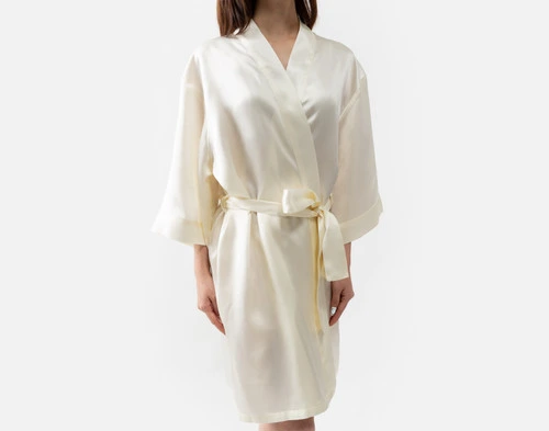 Side view of our Snow Silk Kimono Robe being worn by a young woman.