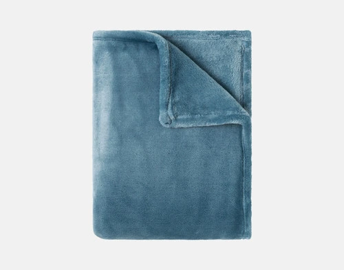 Our Velvet Plush Throw in Bluewater folded neatly into a tidy square.