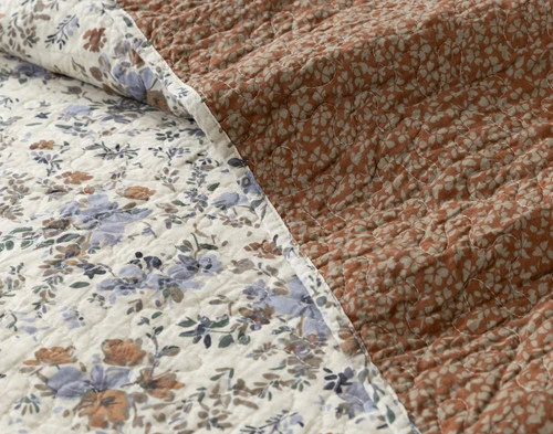 Close-up on the surface and backing floral patterns on our Millie Cotton Quilt Set.