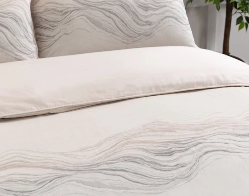 Close angled view of our Striation Duvet Cover to show its soft surface and rippling wave design.