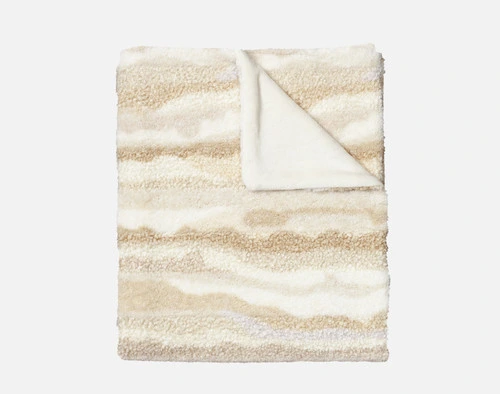 Our Natural Terra Nova Throw folded into a tidy square on a solid white background.