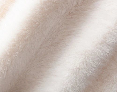 Close-up on the luxuriously fluffy surface of our ______ Arctic Fox Throw.