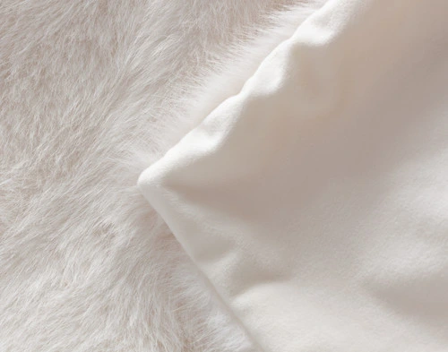 Folded corner on our ______ Arctic Fox Throw to show its coordinating plush velvet backing.