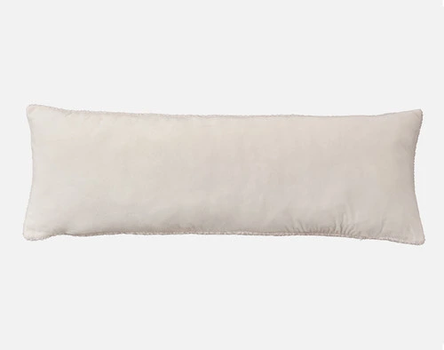 Front view of the smooth velvet backing on our Ripple Boucle Lumbar Pillow in Cream on a white background.