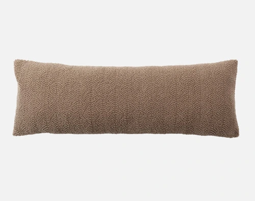 Front view of the soft, textured surface on our Ripple Boucle Lumbar Pillow in Truffle on a white background.