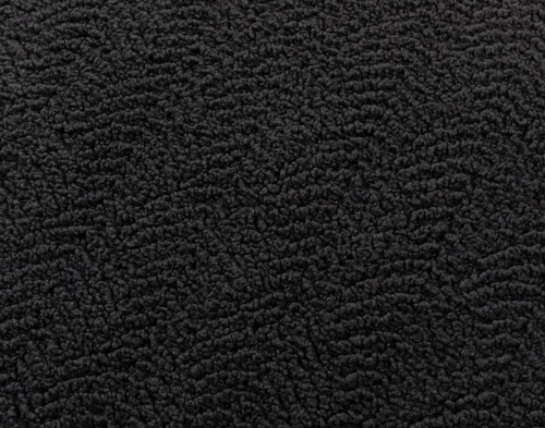 Close-up of the subtle rippling pattern on our Ripple Boucle Lumbar Pillow in Soot.