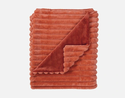 Top view of our Red Cedar Channel Plush Throw folded into a tidy square.