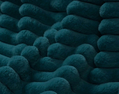 Close-up on the ruffled channel fabric on our Deep Sea Channel Plush Throw.