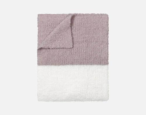 Our Ash & Cream Wooly Knit Throw folded into a tidy square.