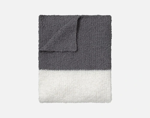 Our Grey & Cream Wooly Knit Throw folded into a tidy square.