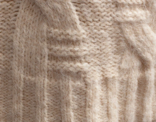 Close-up on the ribbed border on our Cream Fisher Knit Throw.