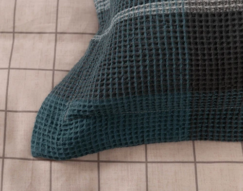 Close-up of the flanged edge border and waffle-like texture on our Marlon Pillow Sham.