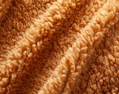 Close-up of the fluffy sherpa backing on our Gold Chevron Etch Throw.