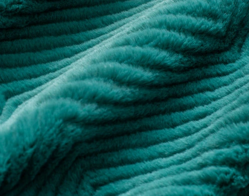 Close-up of the chevron texture and faux fur surface on our Deep Sea Chevron Etch Throw.