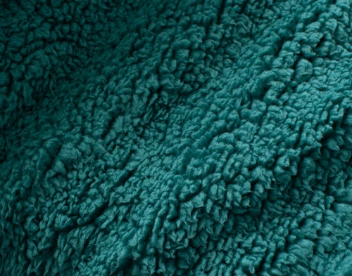 Close-up of the fluffy sherpa backing on our Deep Sea Chevron Etch Throw.