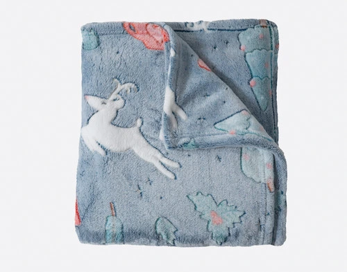 Our Sweet Treats Glow in the Dark Fleece Throw folded into a square.