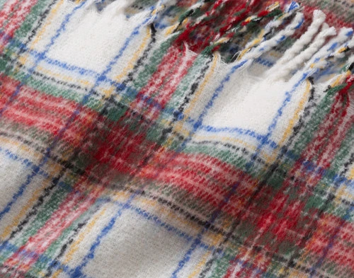 Close-up of the surface and fringed edge on our Holiday Plaid Mohair Throw.