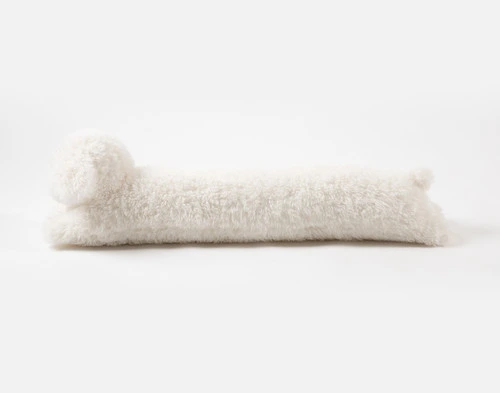 Side view of the extra long body of our Mochi Stuffy Boudoir Cushion.