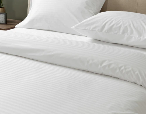 Angled view of the smooth surface on our Striped White Cotton Percale Blend Duvet Cover.