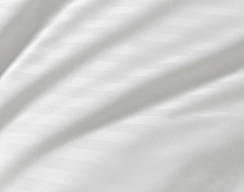 Close-up on the subtle striped surface of our Striped White Cotton Percale Blend Duvet Cover.