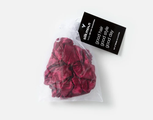 Top view of the mesh bag packaging holding our Cherry Mulberry Silk Scrunchie Set.