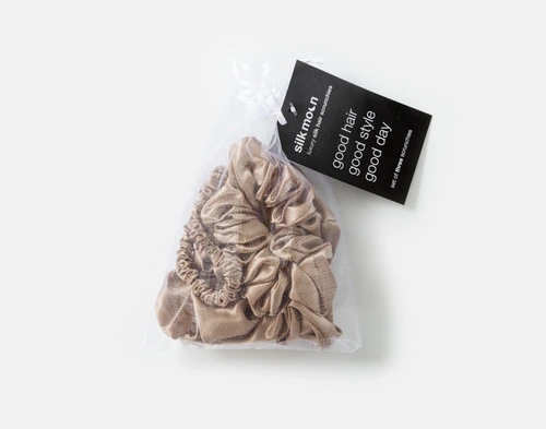 Top view of the mesh bag packaging holding our Bronze Mulberry Silk Scrunchie Set.