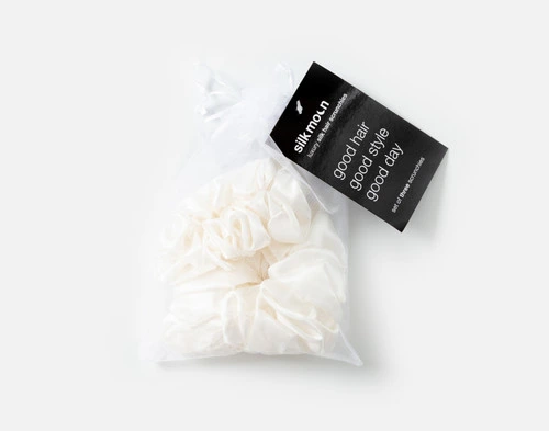 Top view of the mesh bag packaging holding our White Mulberry Silk Scrunchie Set.