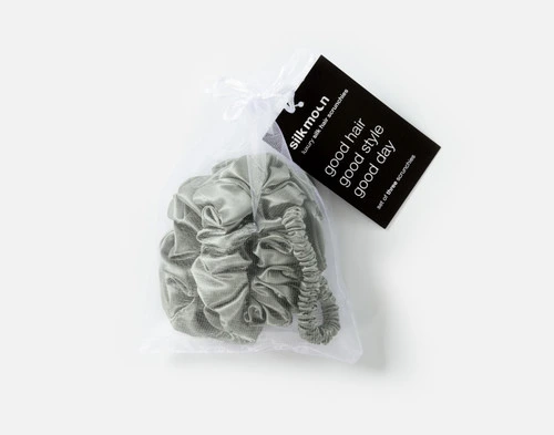 Top view of the mesh bag packaging holding our Sage Mulberry Silk Scrunchie Set.