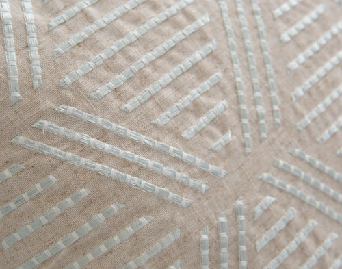 Close up of our Bayview Square Cushion Cover, showing its intricate embroidery detailing.