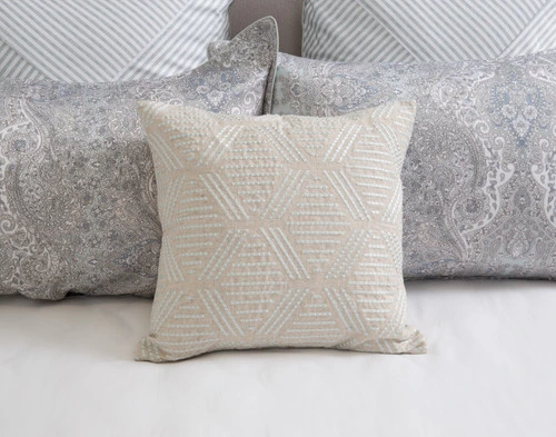 Our Bayview Square Cushion Cover at the head of a bed dressed with our Bayview Pillow Shams.